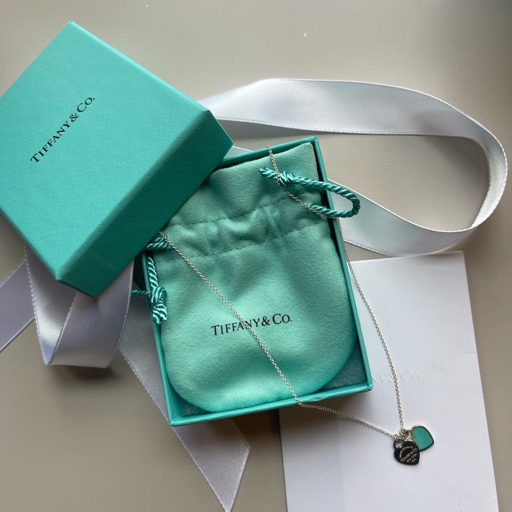 Tiffany blue double heart tag necklace on 16” chain.